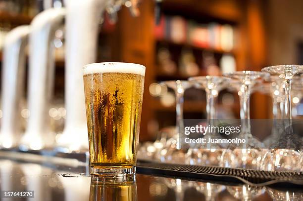 glass of beer - lager stock pictures, royalty-free photos & images