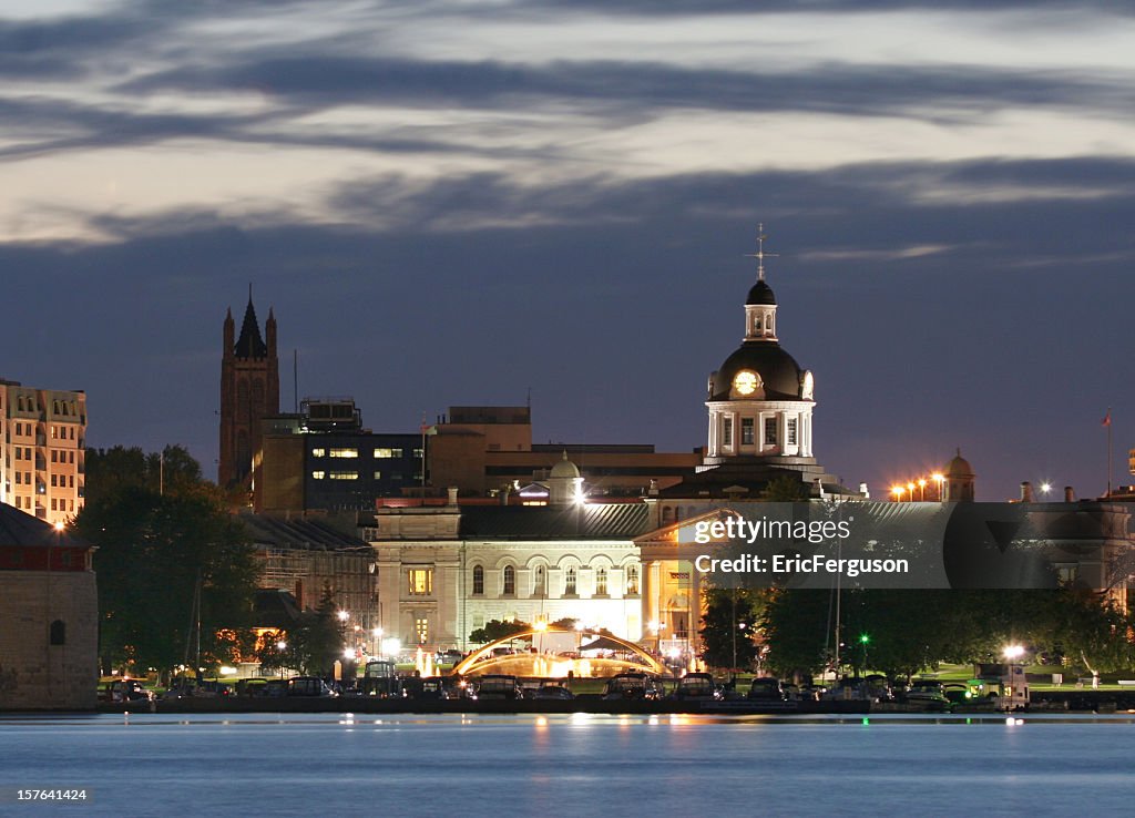 Kingston waterfront at night with cloudy sky over the church