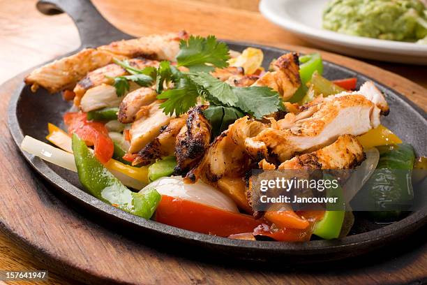 sizzling fajitas - fajita stock pictures, royalty-free photos & images