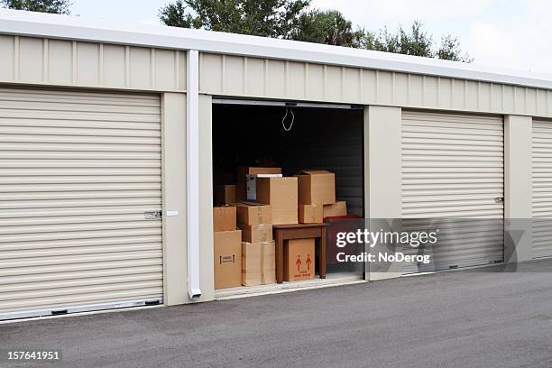 self storage warehouse with single storage unit open to - opslagruimte stockfoto's en -beelden