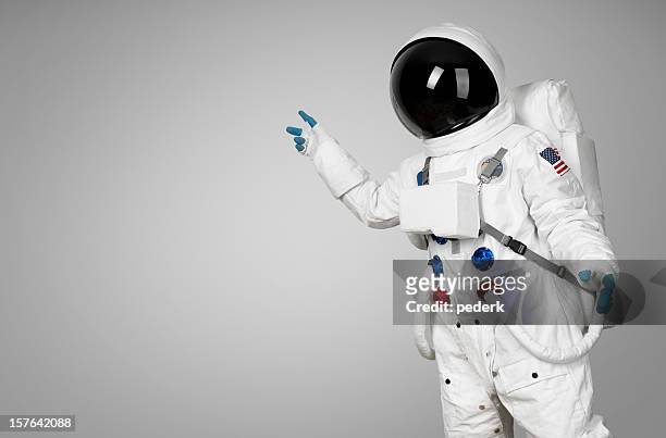 spaceman showing - cosmonaut stockfoto's en -beelden