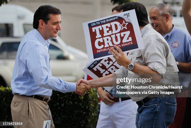 Ted Cruz, Republican candidate for U.S. Senate, shakes hands with supporters and voters at St. Martin's Episcopal Church on Tuesday, July 31 in...