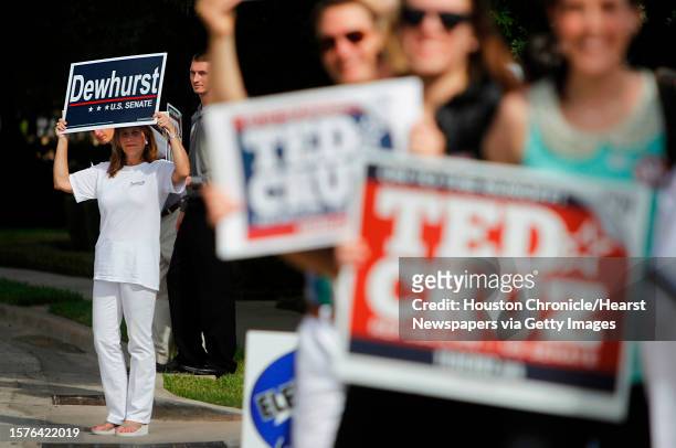Dewhurst supporter stands alone as supporters for Ted Cruz, Republican candidate for U.S. Senate, wait for his visit at St. Martin's Episcopal Church...