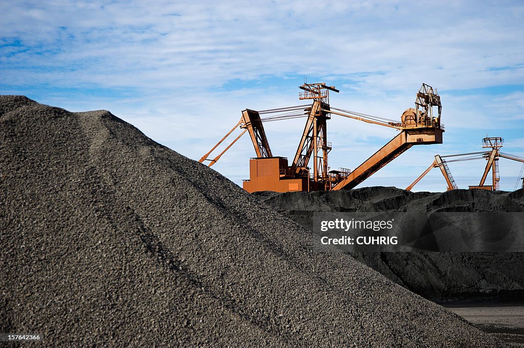 Manganese Ore Stock Pile stacker in background