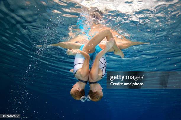 beautiful synchronized swimming unity - artistic swimming stock pictures, royalty-free photos & images