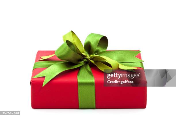 christmas gift with a green bow - christmas present isolated stock pictures, royalty-free photos & images