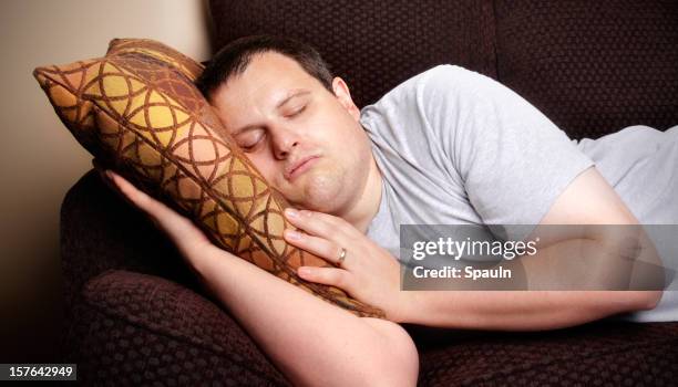 sleeping on the couch - lazy husband stock pictures, royalty-free photos & images