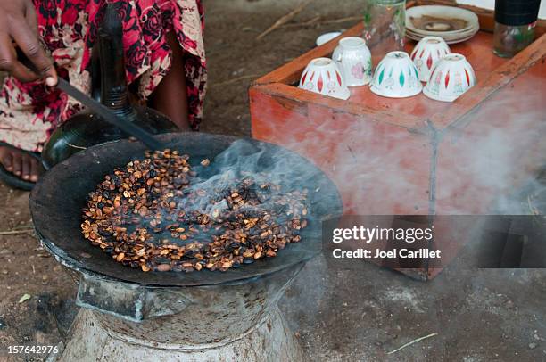 traditional coffee ceremony with roasted coffee in arba minch, ethiopia - ethiopian coffee ceremony stock pictures, royalty-free photos & images