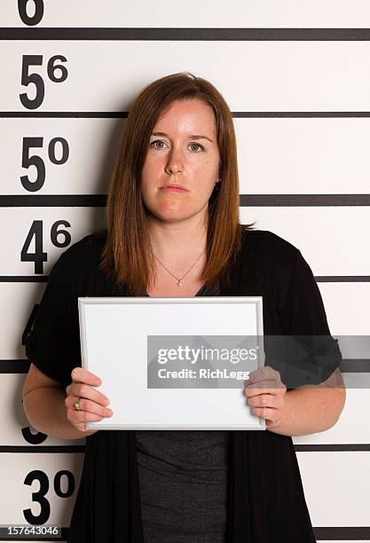 mugshot einer frau - police line up stock-fotos und bilder