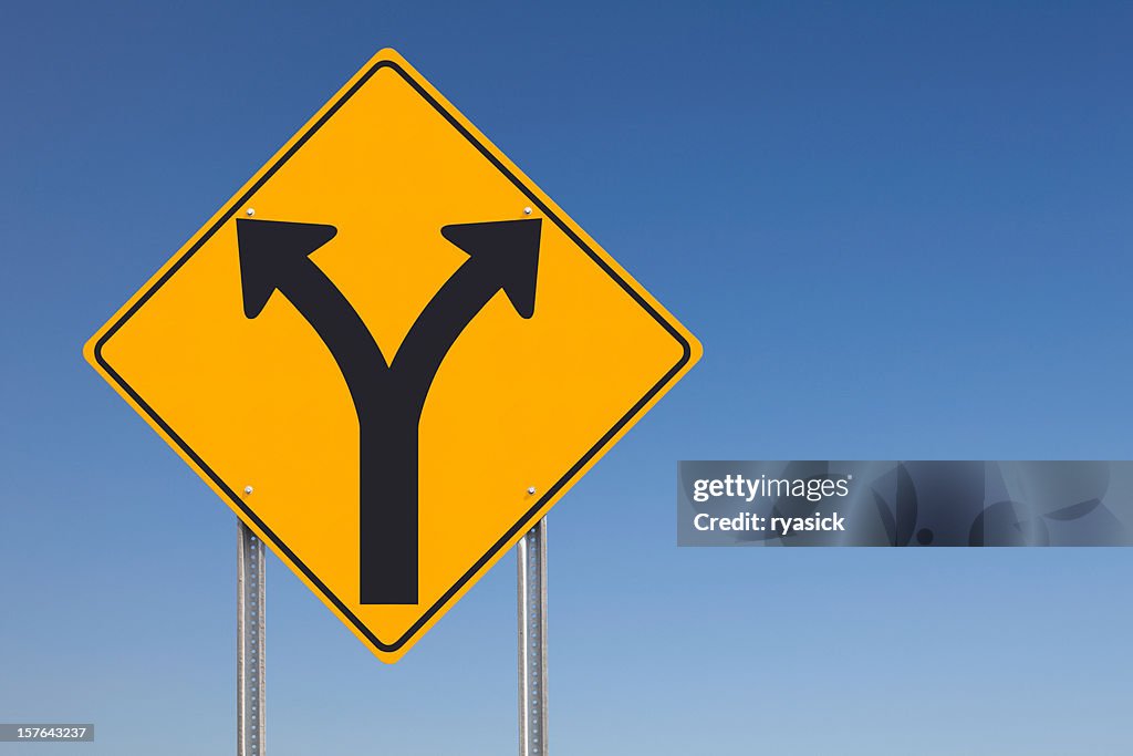 Choice Ahead Division Traffic Sign on Blue Sky Background