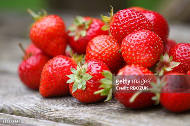 tumble of strawberries - strawberry stock pictures, royalty-free photos & images