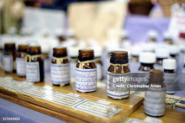 essential oils on a market stall - aromatherapy oil stock pictures, royalty-free photos & images