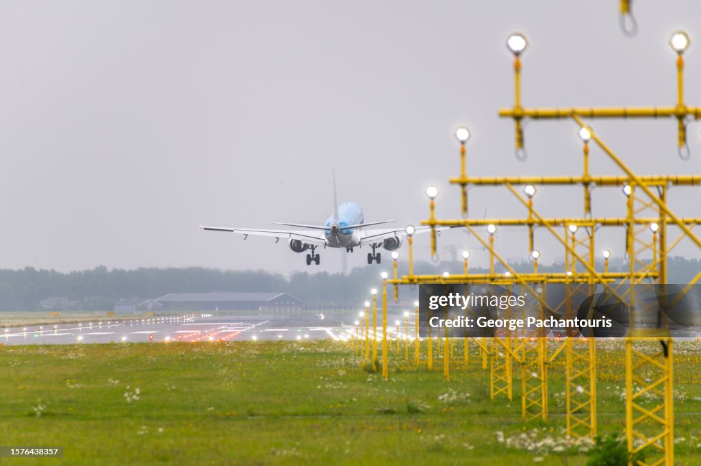 Passenger aircraft landing on a lit runway