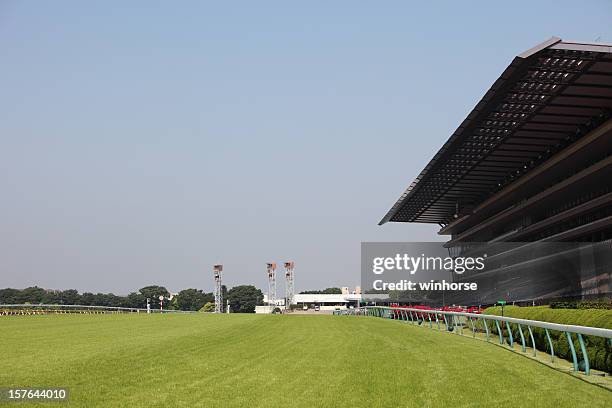 horse racing track - horse racecourse stock-fotos und bilder