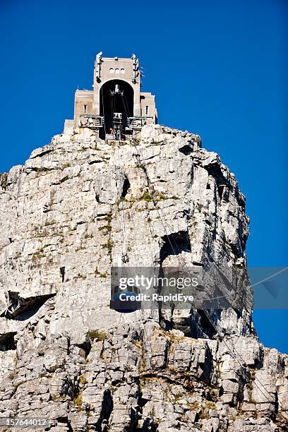 table mountain cable car rises to station on summit - cape town cable car stock pictures, royalty-free photos & images