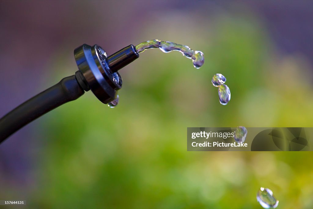 Close-up of water dripping out of a water drop system