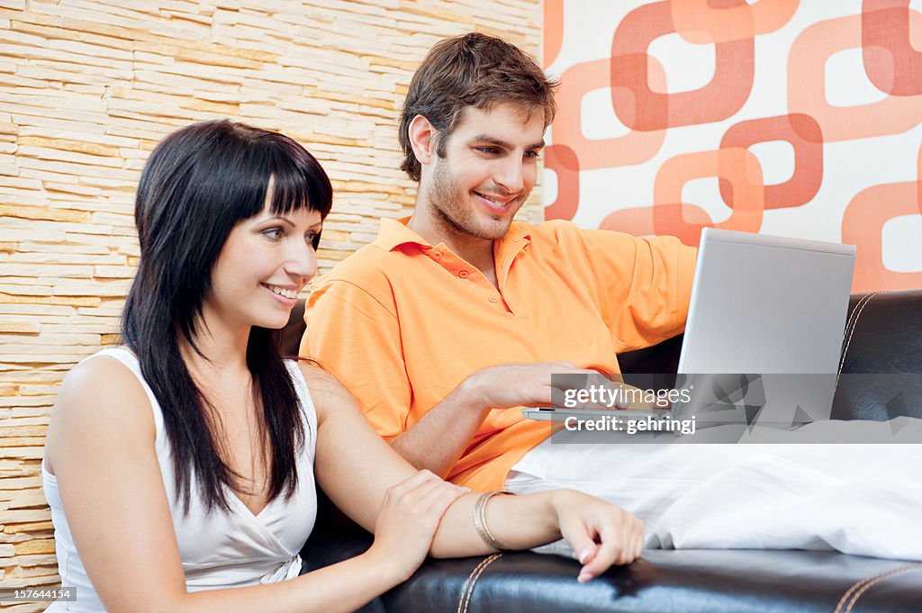 Young happy couple in the living room