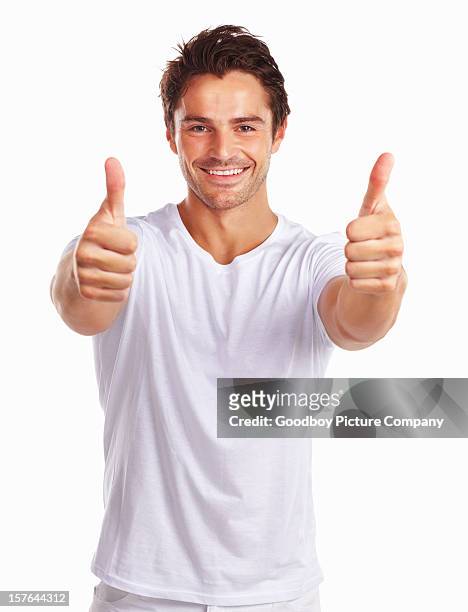 sonriente hombre atractivo mostrando pulgar hacia arriba señales - fresh deals fotografías e imágenes de stock