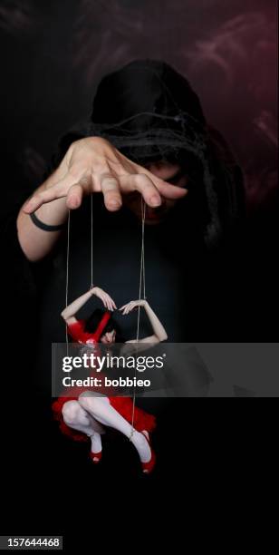 evil puppeteer - marionette stockfoto's en -beelden