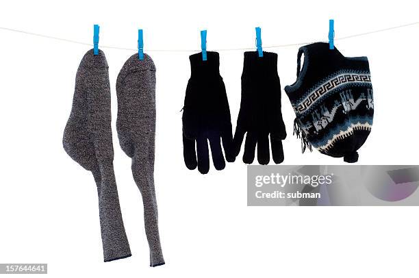 winter wear on washing line - clothes peg isolated stock pictures, royalty-free photos & images