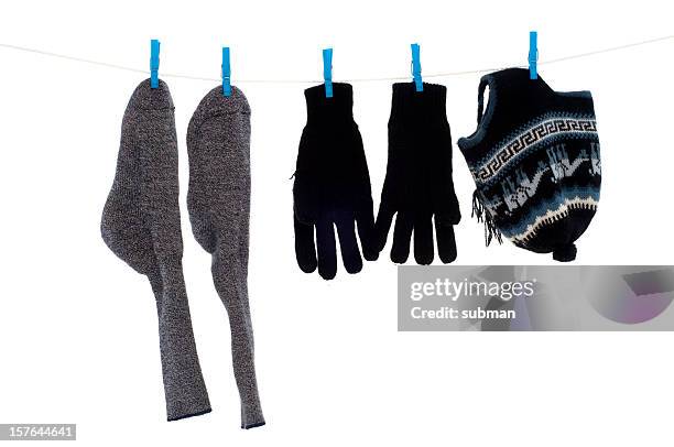 winter wear on washing line - socks isolated stock pictures, royalty-free photos & images