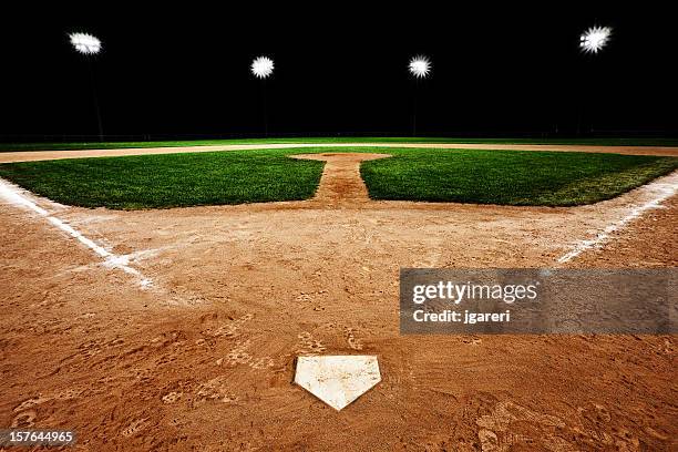 baseball diamond at night - baseball grass stock pictures, royalty-free photos & images