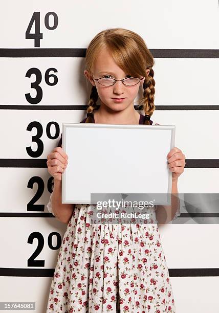 mugshot of a little girl - girl mugshots stock pictures, royalty-free photos & images