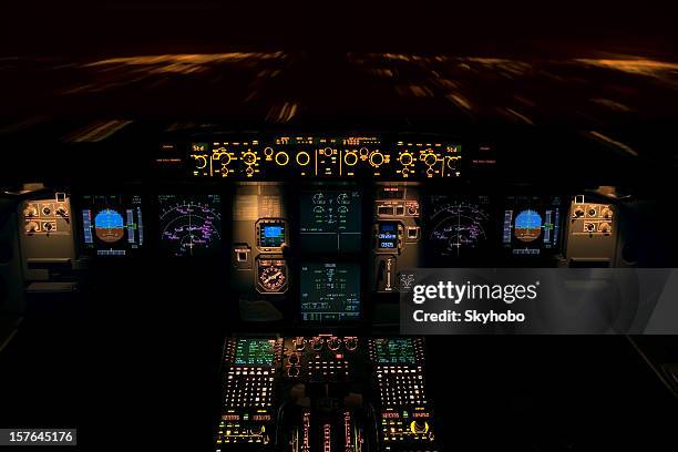 pilot dashboard during a night flight - cockpit stock pictures, royalty-free photos & images