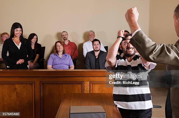 prisoner celebrating in court - handcuffed man standing in courtroom stock pictures, royalty-free photos & images