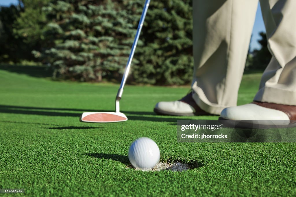 Golfer Sinking a Short Putt