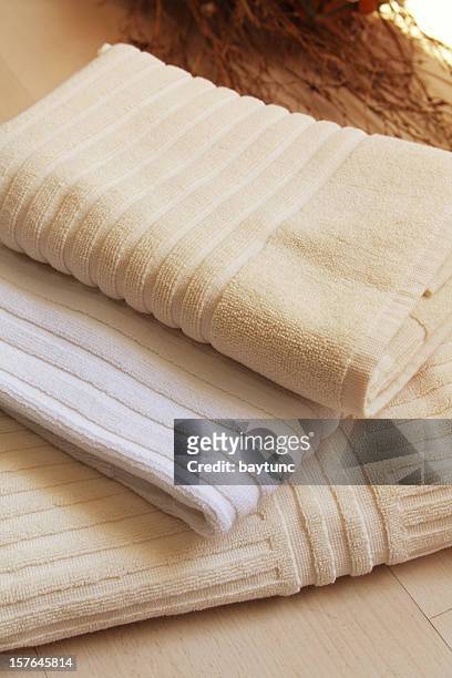 stack of towels - folded towels stock pictures, royalty-free photos & images