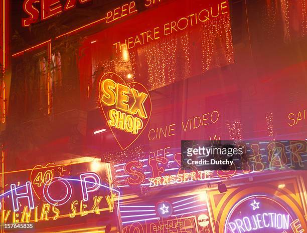neon lights at the red light district of paris, france. - the place pigalle in paris stock pictures, royalty-free photos & images