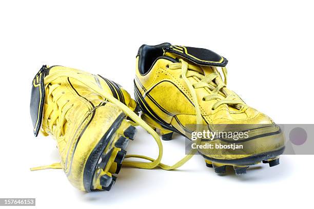 yellow soccer cleats - soccer boot stock pictures, royalty-free photos & images