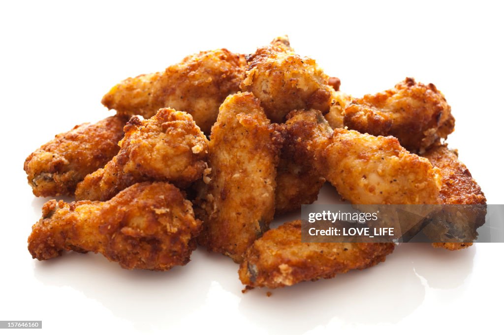 Pile of chicken wings on a white background