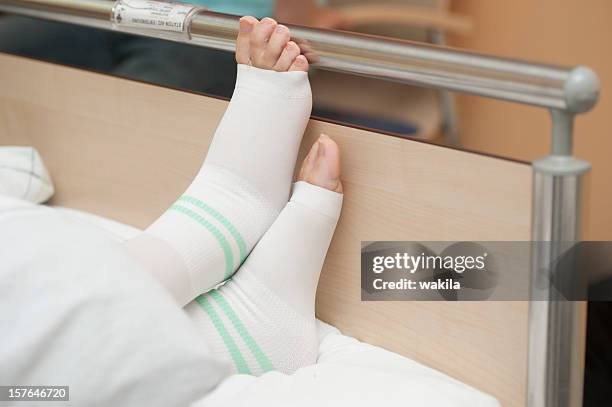 at the clinic - foot in bed with thrombosis stockings - blodpropp bildbanksfoton och bilder