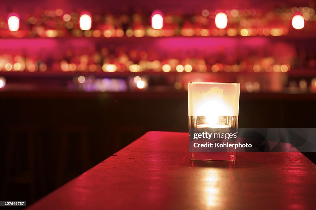 Bar scene with candle