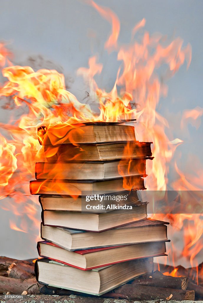 Stack of hardcover burning books
