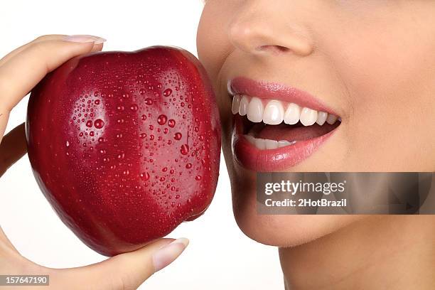 closeup of apple with woman's open mouth xxxl - 2hotbrazil bildbanksfoton och bilder