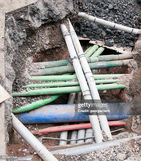 complex underground pipes - sewage services stock pictures, royalty-free photos & images