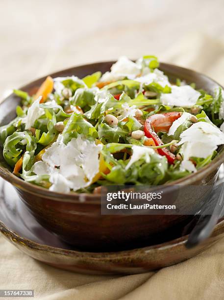 arugula salad with peppers, pine nuts and grated cheese - poppy seed stock pictures, royalty-free photos & images