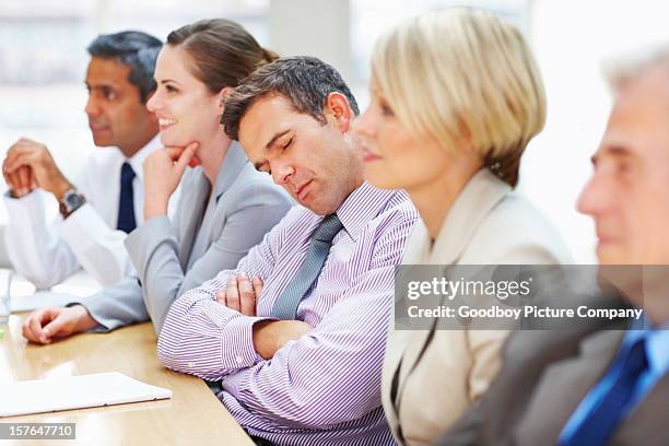 tired executive falls asleep during a business meeting - boring meeting stock pictures, royalty-free photos & images