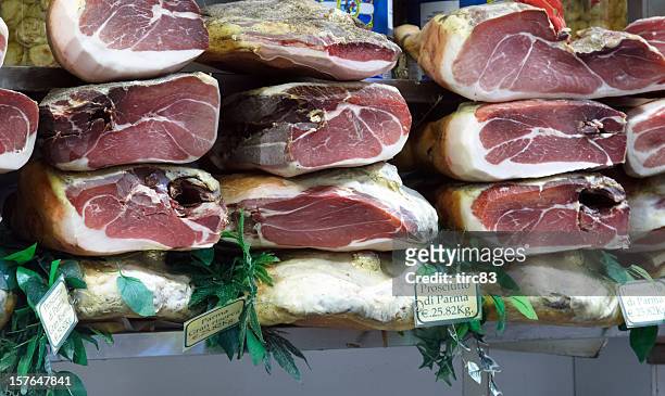 display of parma hams - parma italy stock pictures, royalty-free photos & images