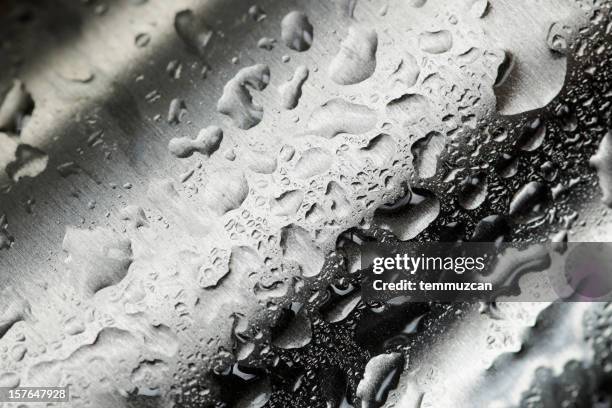 water droplets collecting on waved metal - rostfritt stål bildbanksfoton och bilder