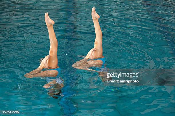parallel legs of synchronized swimming girls - synchronized swimming stock pictures, royalty-free photos & images