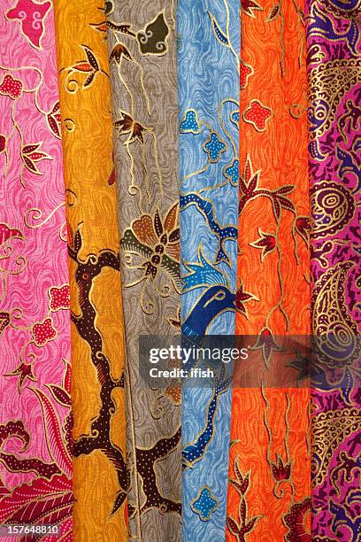 colourful painted batik textiles at indonesian textile market. - batik dress stock pictures, royalty-free photos & images