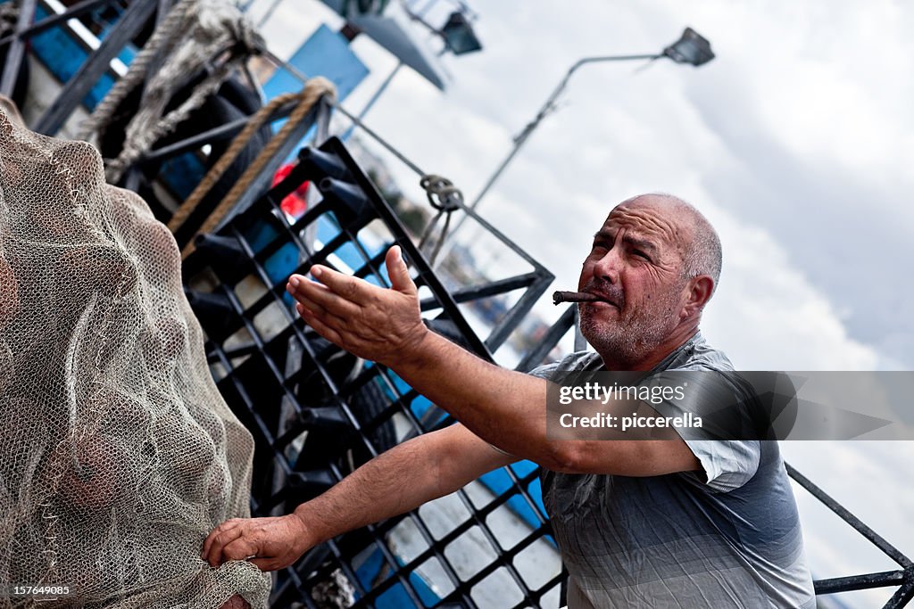 Fisherman Holding Fishing Net