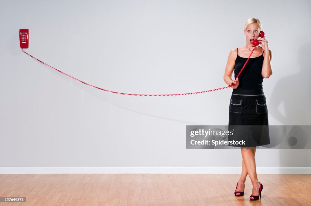 Quirky Blonde With Red Telephone