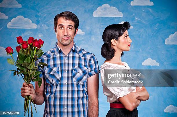 nerd with red roses on a date - red couple stockfoto's en -beelden