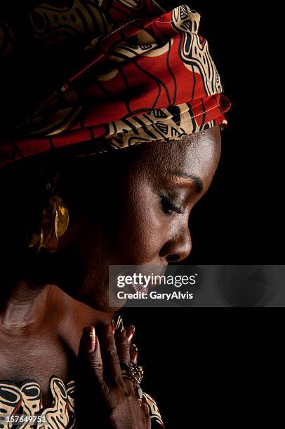 side view of expressive african woman in traditional headdress - artists model stock pictures, royalty-free photos & images