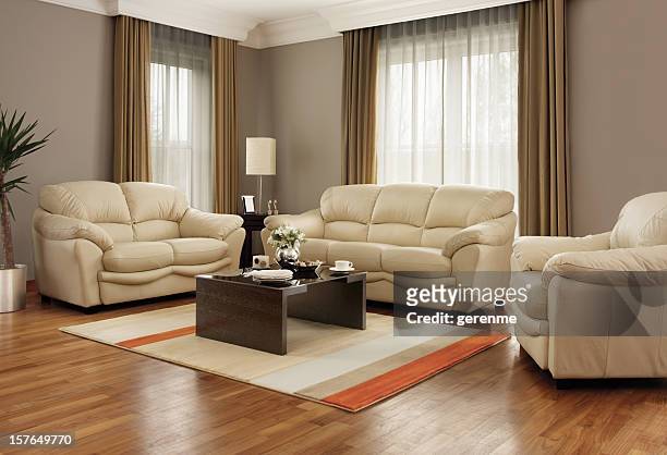 living room - leather couch stock pictures, royalty-free photos & images
